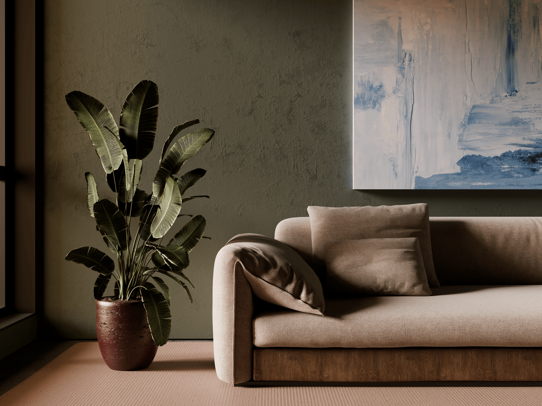 Closer composition of the sofa, textured wall, artwork, and planting